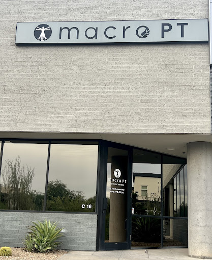 The front of a building with a sign that reads macro pt