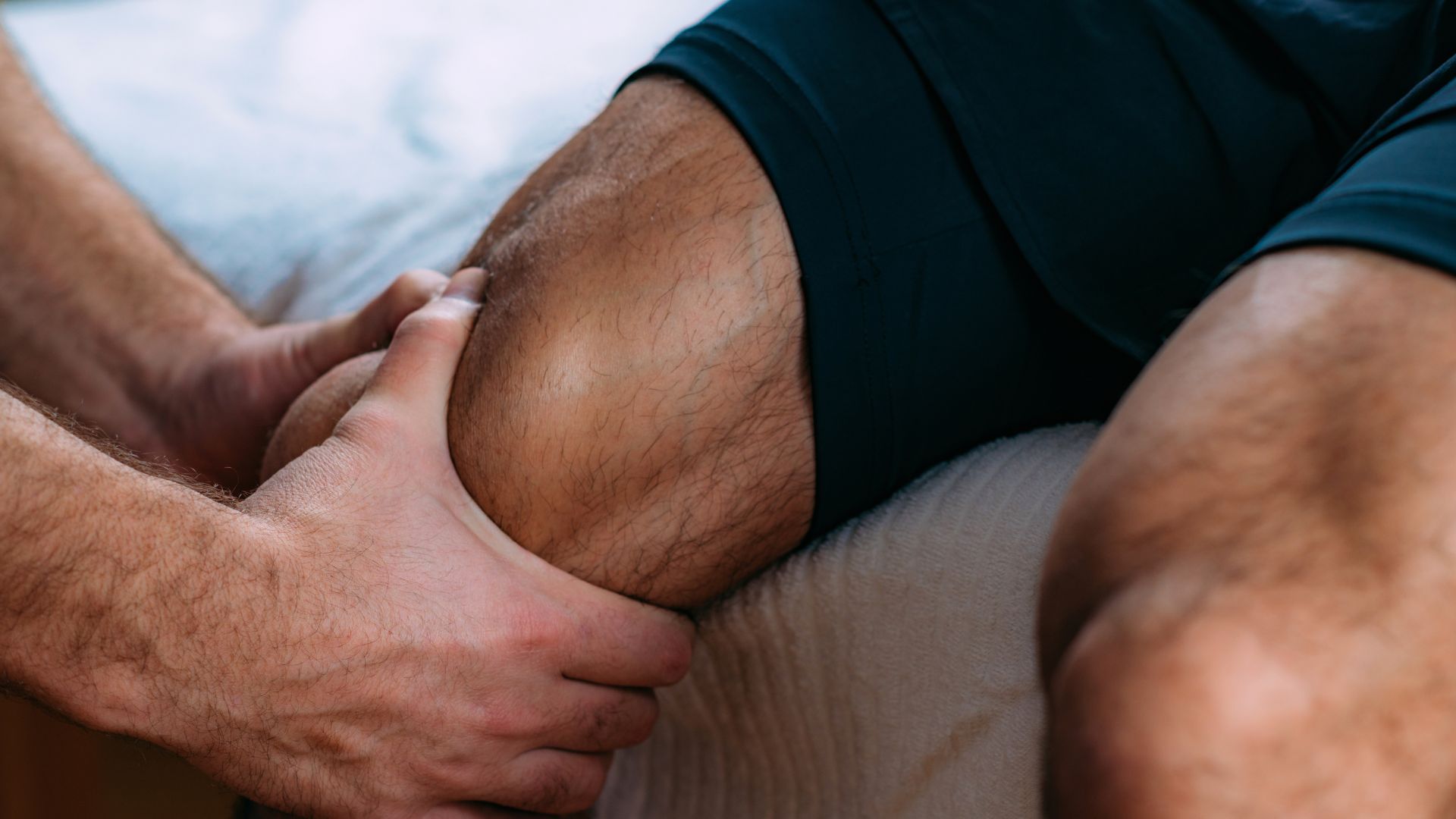 A close up of a person laying on a bed