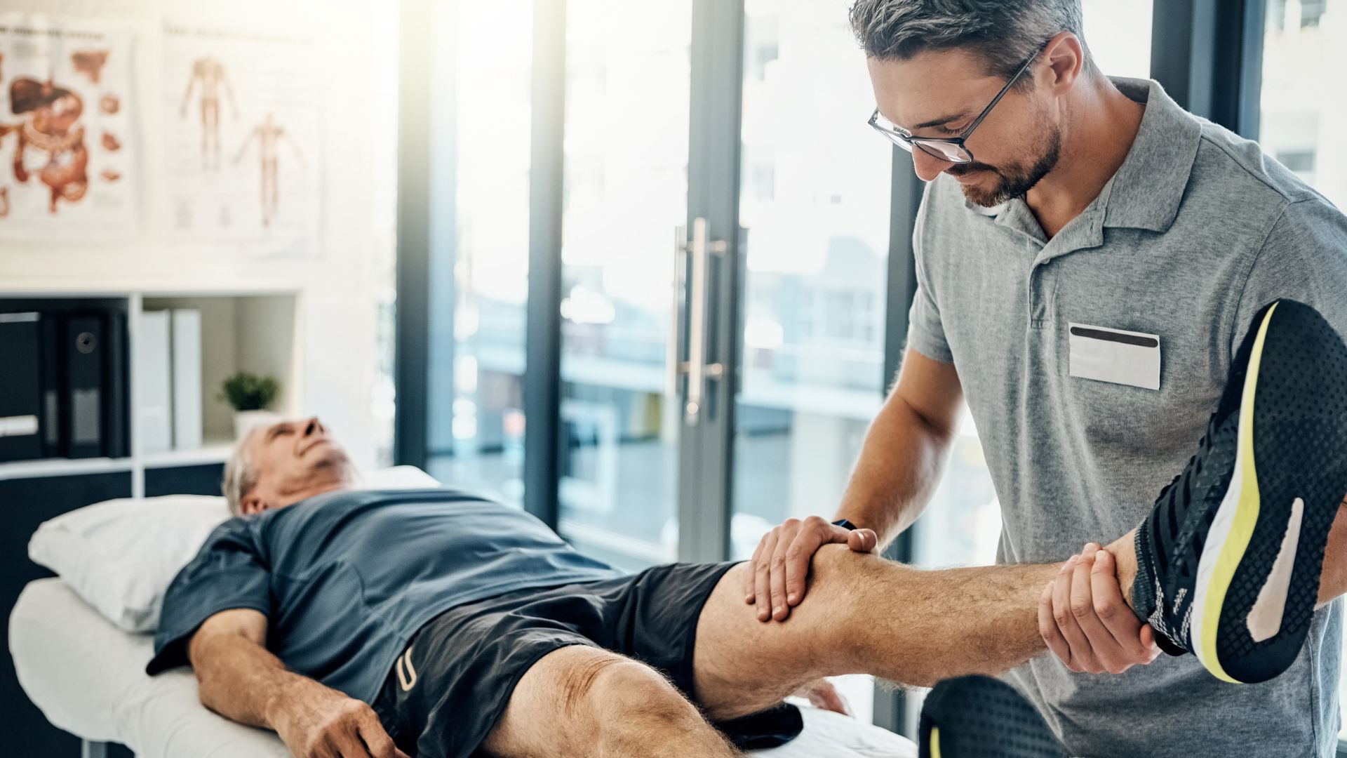 A man getting his leg examined by a doctor